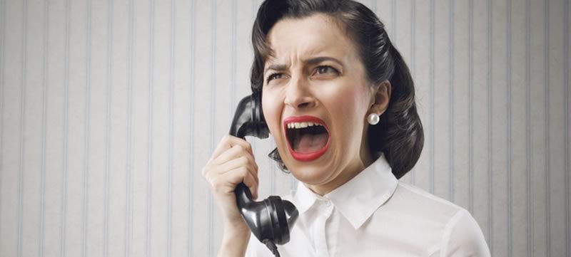 Stressed out woman on old fashioned phone